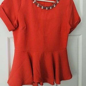 Fancy peplum blouse with beaded neckline